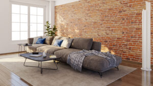 Cegła na ścianie w mieszkaniu przywołuje skojarzenia z industrialnym loftem, manufakturą z przełomu wieków lub kawiarniami z ekspozycją surowego muru